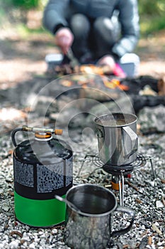 Gas stove, camping burner with balloon, selective focus. Equipment for hiking. camping with a tent, tourists