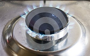 Gas stove flame, with metal bottom.