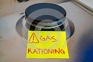 Gas stove and `gas rationing` ticket. Energy crisis and economic recession.