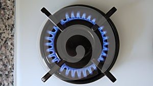 gas stove is lit in the kitchen, burner, fire is ignited, cooking, natural gas, energy crisis, high fuel prices, blue