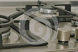 Gas stove with steel hob close-up
