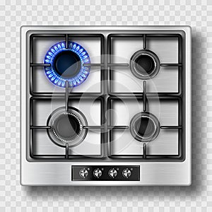 Gas stove top view with blue flame and steel grate