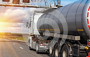 Gas-tank goes on highway against the sky