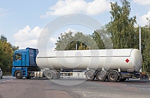 A gas tanker on a city highway