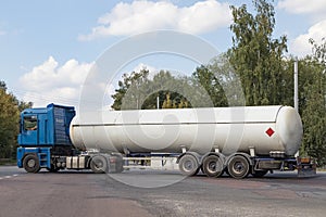 A gas tanker on a city highway