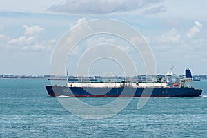 Gas tanker ship, LNG ship, arriving to port of Singapore.