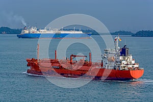 Gas tankers is passing by Singapore Strait.