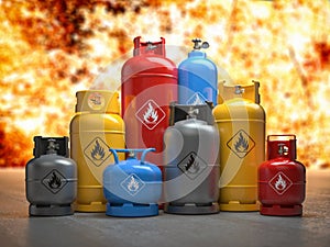 Gas tanks or bottles on explosive flame and fire background. Danger of using gas concept