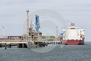 Gas transshipment terminal in harbor Rotterdam, biggest seaport of Europe photo