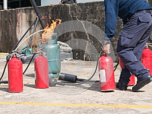 Gas tube burn while fireman holding fire extinguisher in fire dr