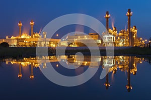 Gas turbine electrical power plant at dusk with blue sky