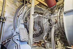 Gas turbine engine of feed gas compressor inside enclosure. photo