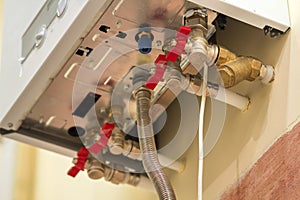 Gas water heater boiler for home heating, bottom view. Installation, connection and maintenance concept