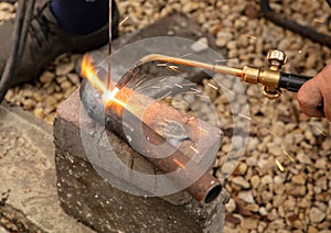 Gas welding of metal at the construction site.