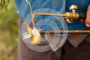 Gas welding of metal at the construction site.