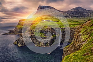 Gasadalur village and Beautiful waterfall, At Sunset, Vagar, Faroe Islands