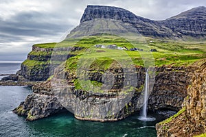 Gasadalur village and Beautiful waterfall,Vagar, Faroe Islands photo