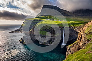 Gasadalur waterfall in Faroe Islands at dusk