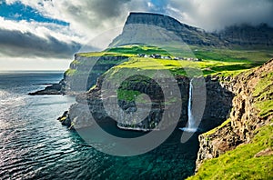 Gasadalur waterfall wide angle view at dusk