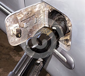 Gasoline filler hose nozzle in a vehicle