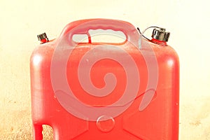 Gasoline plastic reserve gallon red color.