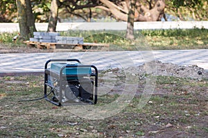 Gasoline portable generator on the street. Close up on mobile backup generator