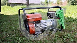 Gasoline-powered electric generator in a state of operation.