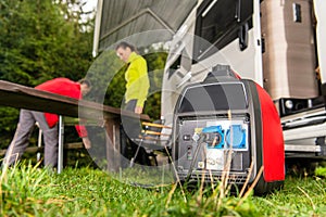 Gasoline Powered Generator Running Next to Camper Van RV