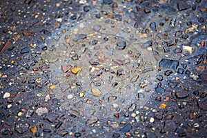 Gasoline spot wet asphalt background