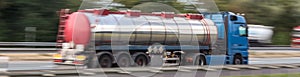 Gasoline transportation truck on highway speed blur