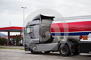 Gasoline truck near a gas station