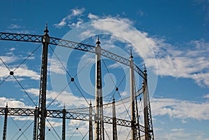 Gasometer against a Blue Cloudy Sky