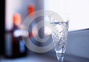 Gass of alcohol on windows desk background