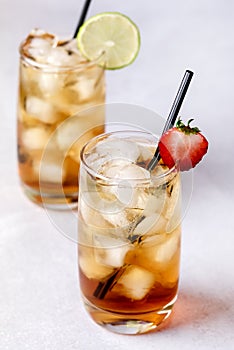 Gasses of Cold Citrus and Strawberry Ice Tea Decorated with Slice of Lemon and Strawberry Healthy Summer Drink Vertical