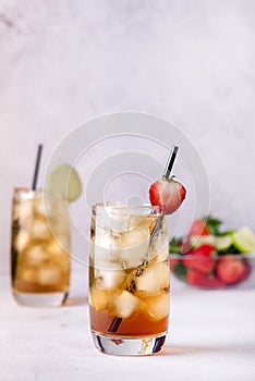 Gasses of Cold Citrus and Strawberry Ice Tea Decorated with Slice of Lemon and Strawberry Healthy Summer Drink Vertical