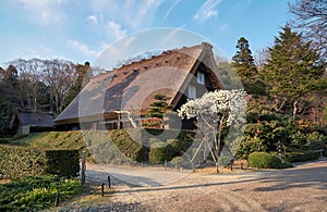 Gassho style house in Higashiyama Zoo and Botanical Garden in the evening light. Nagoya. Japan