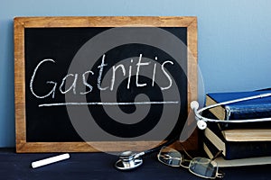 Gastritis written on a blackboard in a hospital. photo