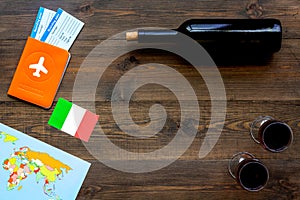 Gastronomical tourism. Italian food symbols. Passport and tickets near italian flag, bottle of red wine, map of the