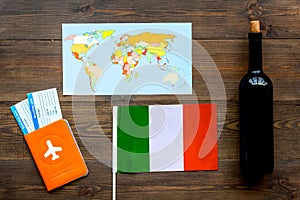 Gastronomical tourism. Italian food symbols. Passport and tickets near italian flag, bottle of red wine, map of the