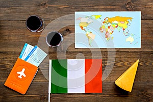 Gastronomical tourism. Italian food symbols. Passport and tickets near italian flag, glass of red wine, map of the world