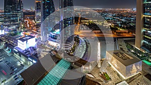 Gate Avenue promenade located in Dubai international financial center aerial night timelapse.