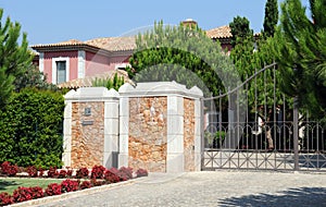 Front Gate from a Big Pink Residence photo