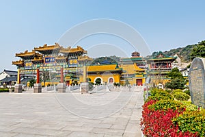 Gate of Chinese traditional royal style colorful temples in the Putuoshan mountains, Zhoushan Islands,  a renowned site in Chinese