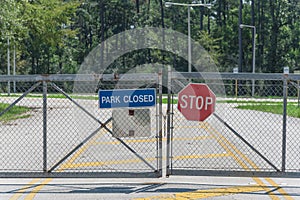 Gate closed at the entrance to park and nature preserve in suburban Houston, Texas, USA