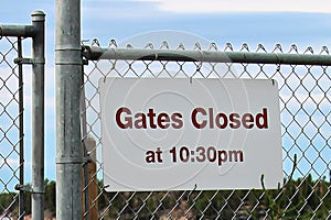 Gate closes at 10:30 pm sign at a beach