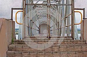 GATE ENTRANCE TO METAL WALKWAY