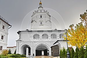 gate for the entrance to the monastery in the white tower with a bell tower