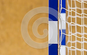 Gate for futsal or handball in gym. Detail of gate frame and net. Outdoor football or handball playground
