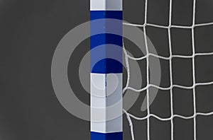 Gate for futsal or handball in gym. Detail of gate frame and net. Outdoor football or handball playground