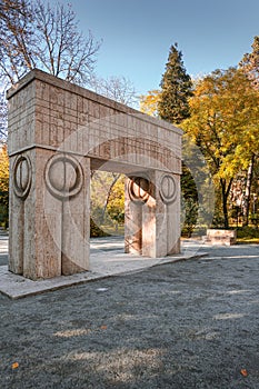 The Gate of the Kiss Poarta sarutului sculpture made by Constantin Brancusi in Targu Jiu, Romania - amazing autumn wide angle vi